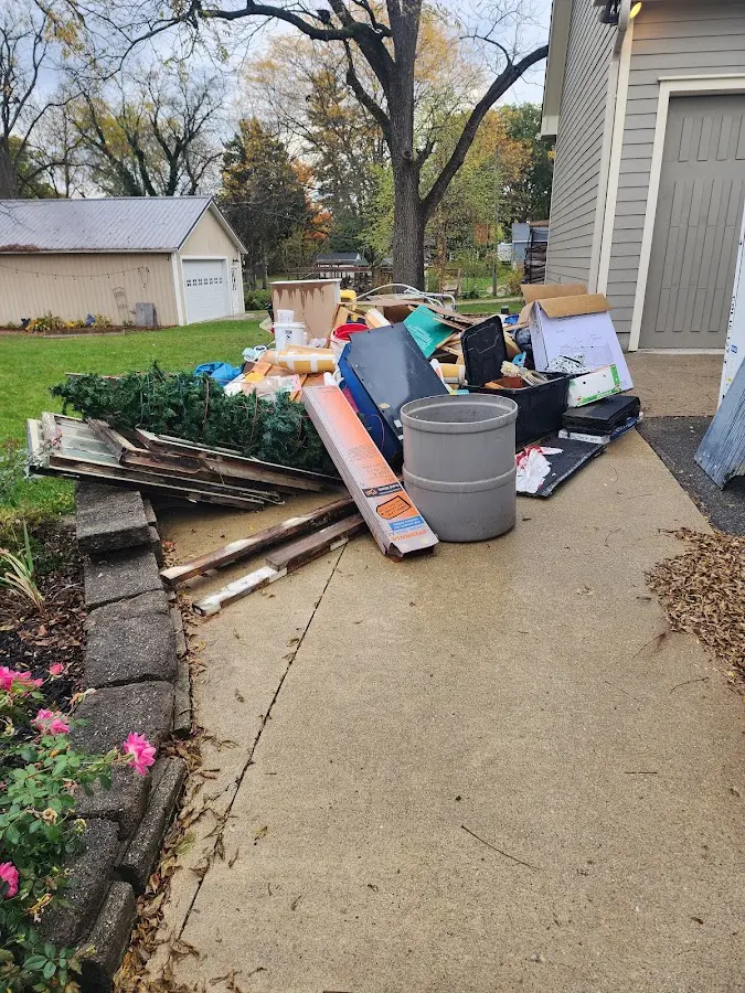 Dumpster being loaded with debris for Demolition Dumpster Rental in East Rochester